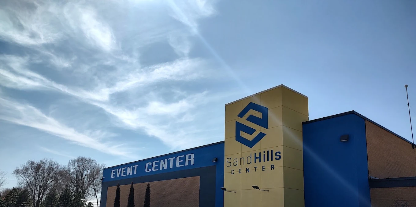 The SandHills Event Center building under a blue Kansas sky in Hutchinson